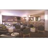 Zona lounge de hotel con butacas tapizadas contract
