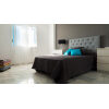 Cabecero tapizado capitoné en habitación (contract)
